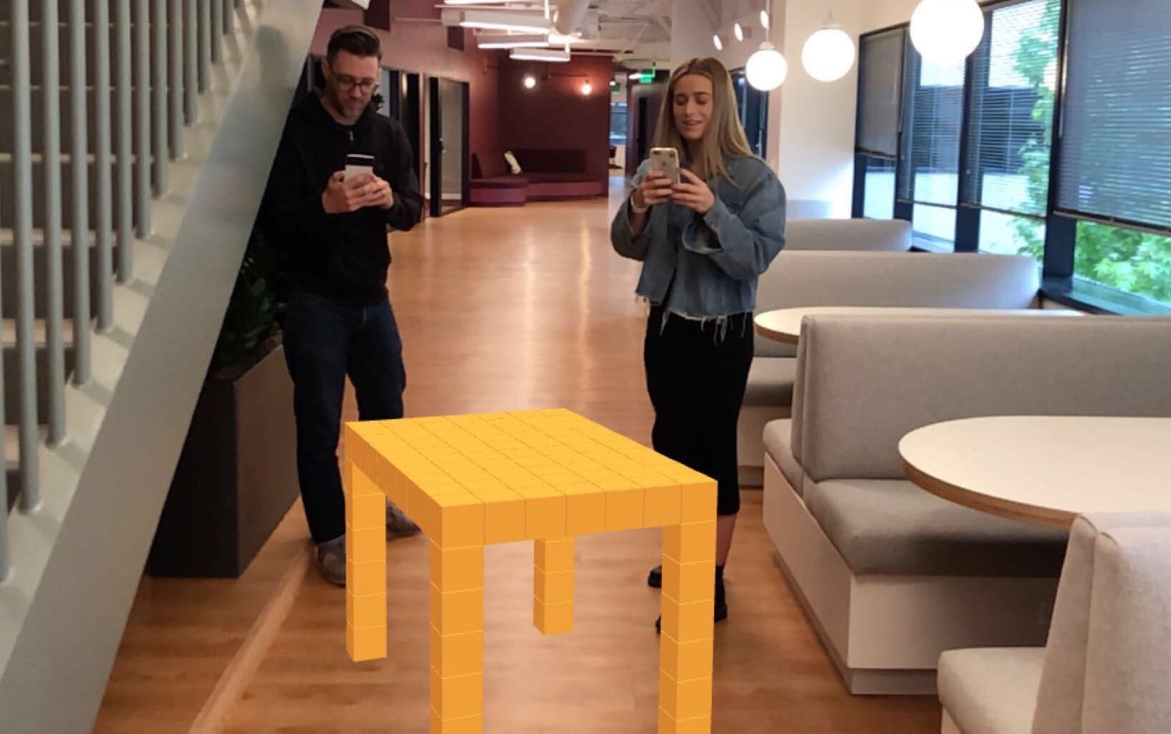 Two Blocks users are collaboratively creating a table in augmented reality.